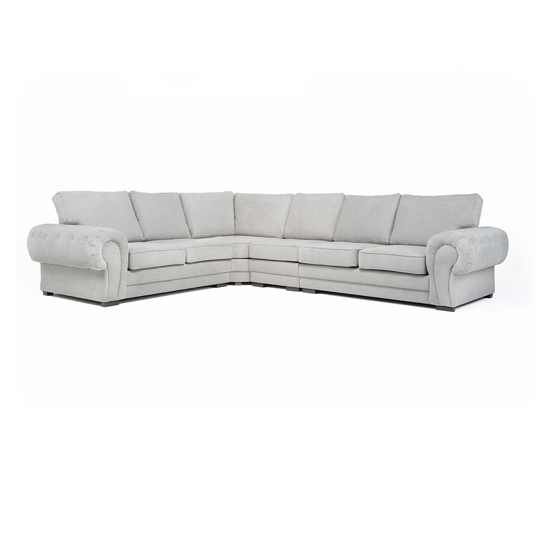 A large grey Verona full back corner sofa with soft polyester upholstery, foam-filled cushions, and chrome feet, arranged in a left-hand corner configuration.